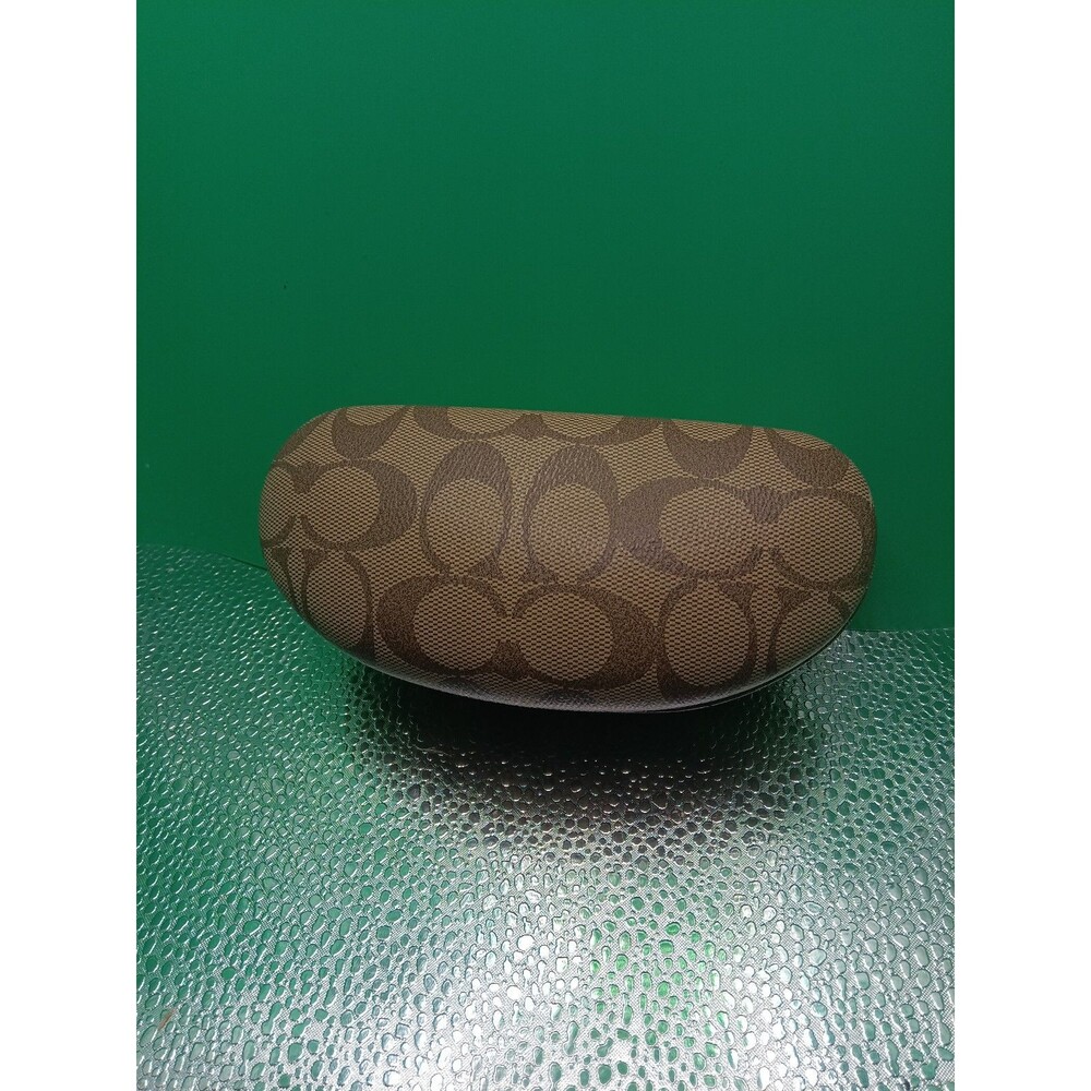 Coach signature C monogram hard-shell clamshell glasses case in a turtle color